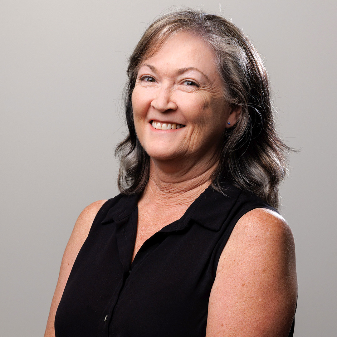 Cathy Orr, Whittles Body Corporate Manager, smiles at the camera in a professional headshot.